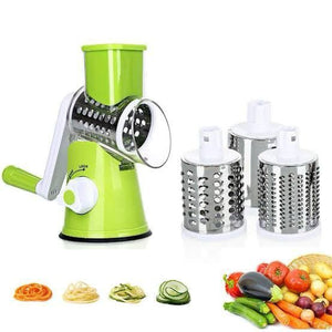 Green manual vegetable spiralizer with three attachments on a white background