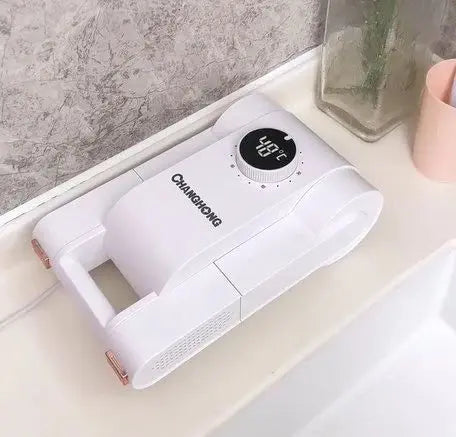 White handheld device with digital display on a bathroom counter